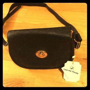 Black and brown purse with shoulder strap